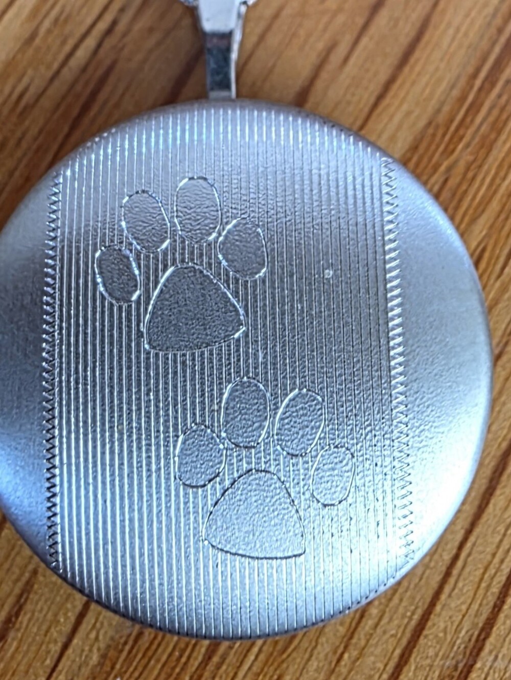 Silver Paw Print Locket 24in Necklace.
